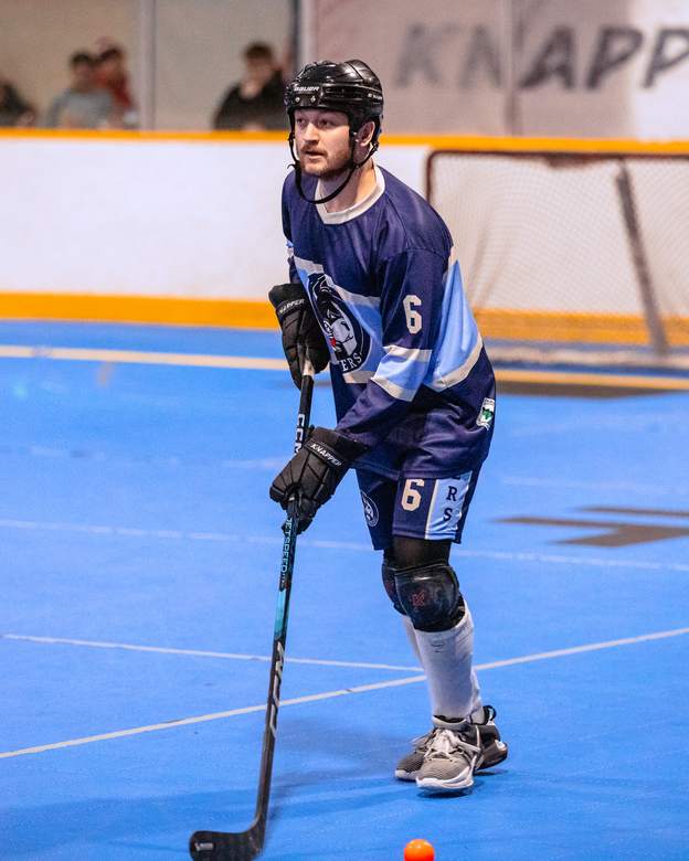 Defenceman carrying the ball out of his zone